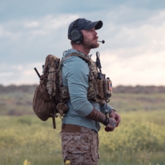 Soldier out in a grassy field using Persistent Systems Products